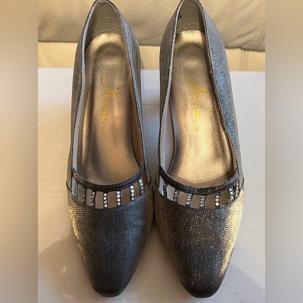 Sparkly silver high heeled pumps, trimmed with rhinestones. Size 7 1/2.